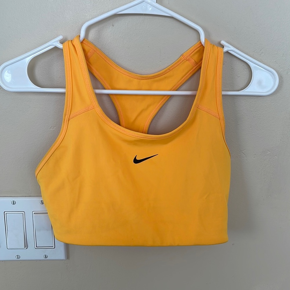 Nike bright orange sports bra. Size medium women